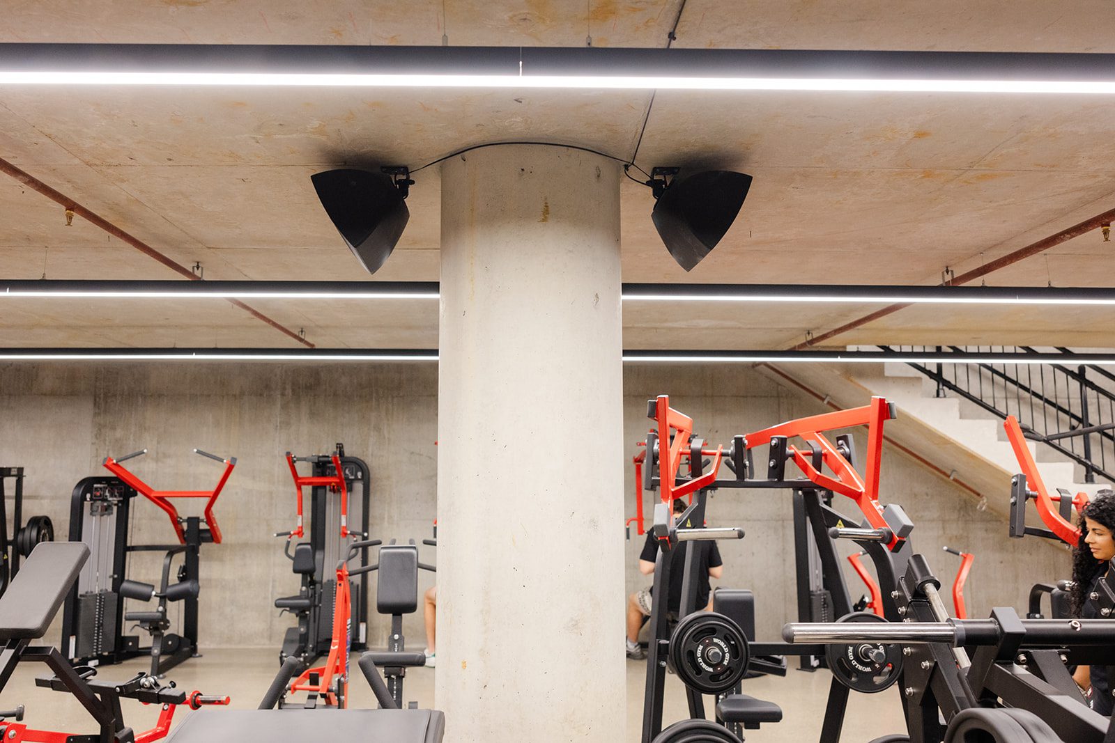 Large-format digital signage and distributed audio system installed by AVE Technologies at World Gym Australia